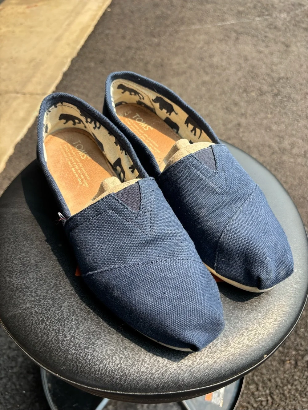 Navy blue slip-on Toms